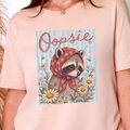 Oopsie Raccoon Graphic Tee - Peach Tee